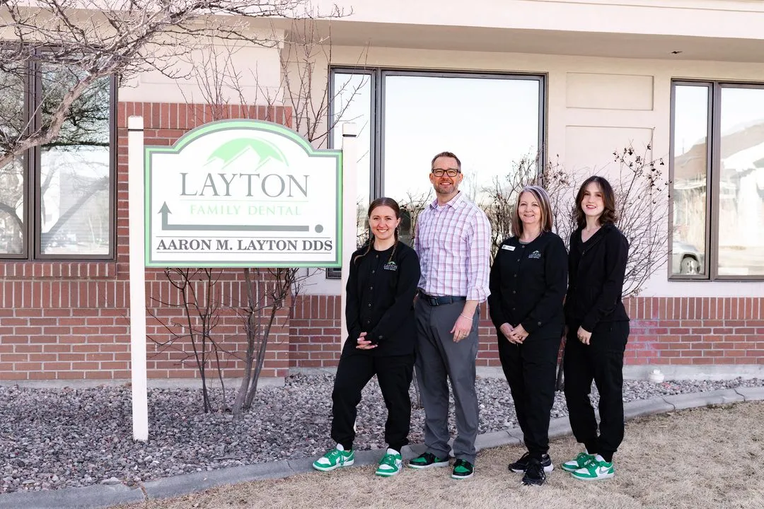 Dr. Aaron Layton and the Layton Family Dental team outside their Fort Collins office